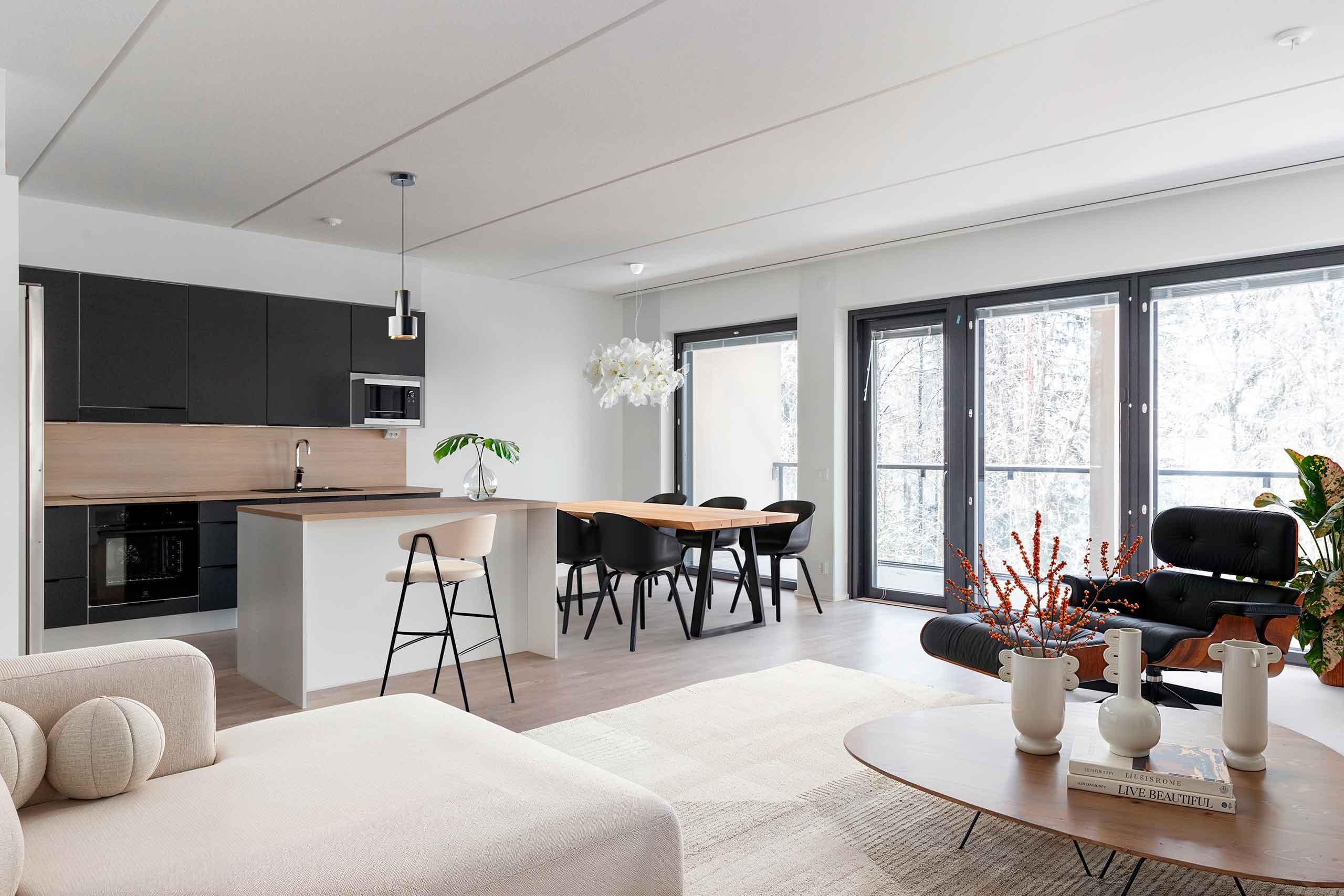 Digitaalisesti sisustettu kuva asunnon olohuoneesta ja keittotilasta