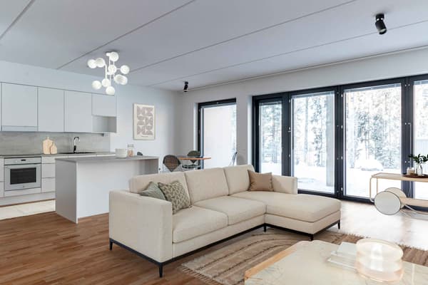 Digitaalisesti sisustettu kuva asunnon olohuoneesta ja keittotilasta